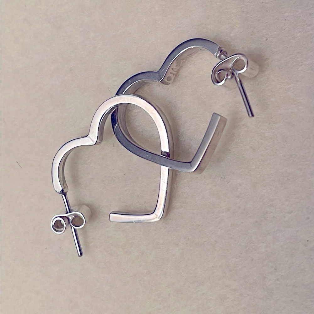 Heart-shaped earrings made of silver, ideal for all times